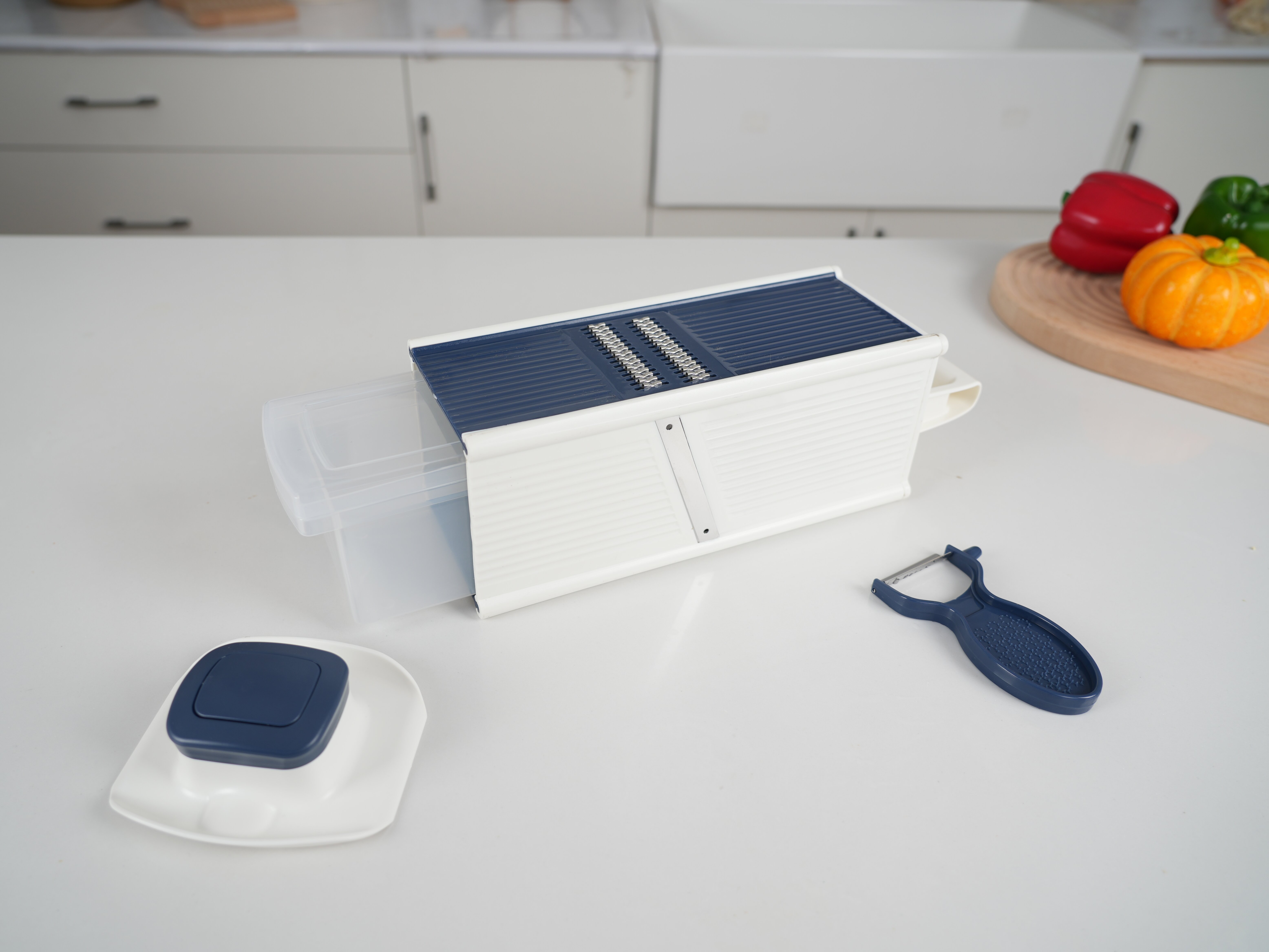 Hand-Held Vegetable Grinder and Mandoline Slicer
