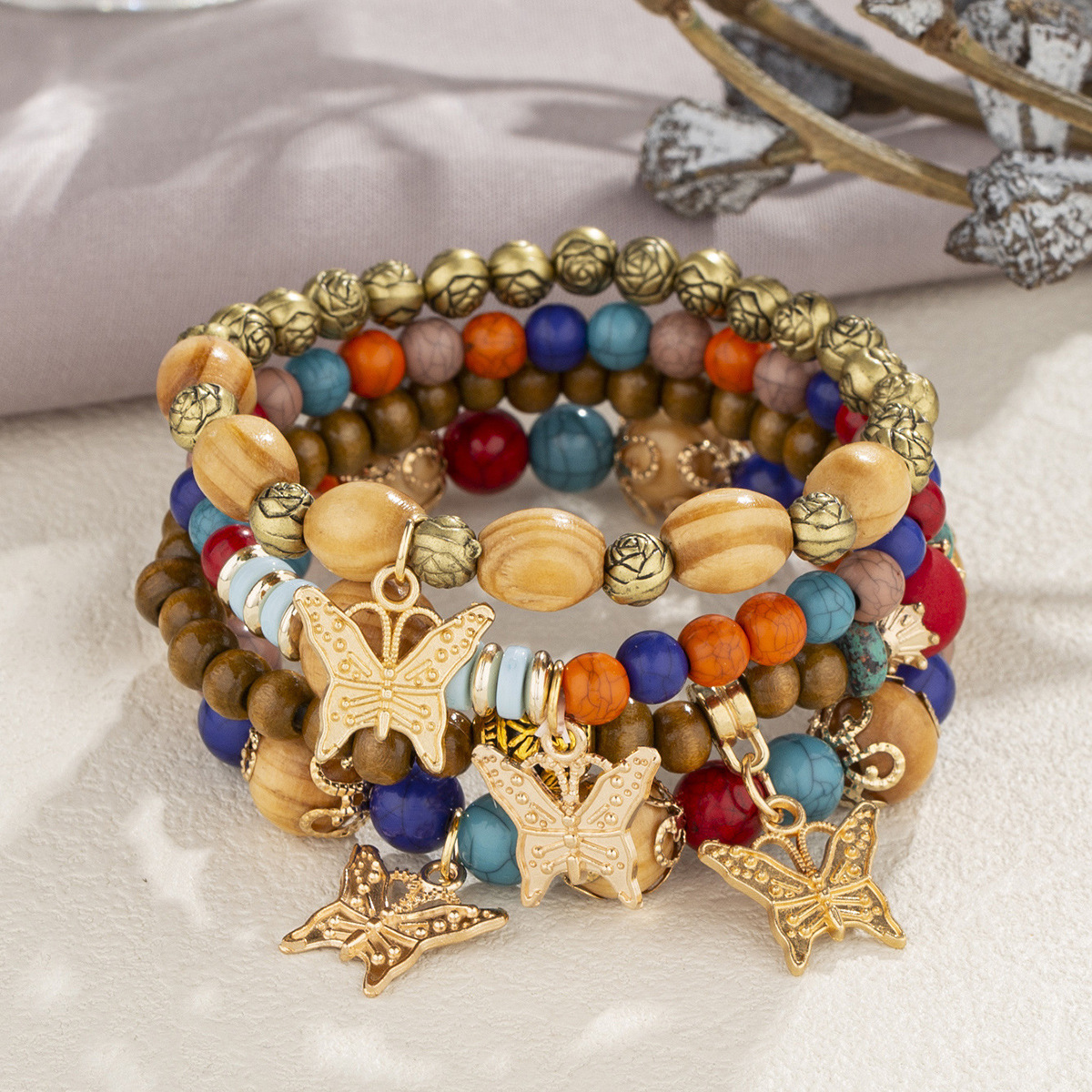 Multi-Layer Wooden Bead Bracelet with Butterfly Pendant