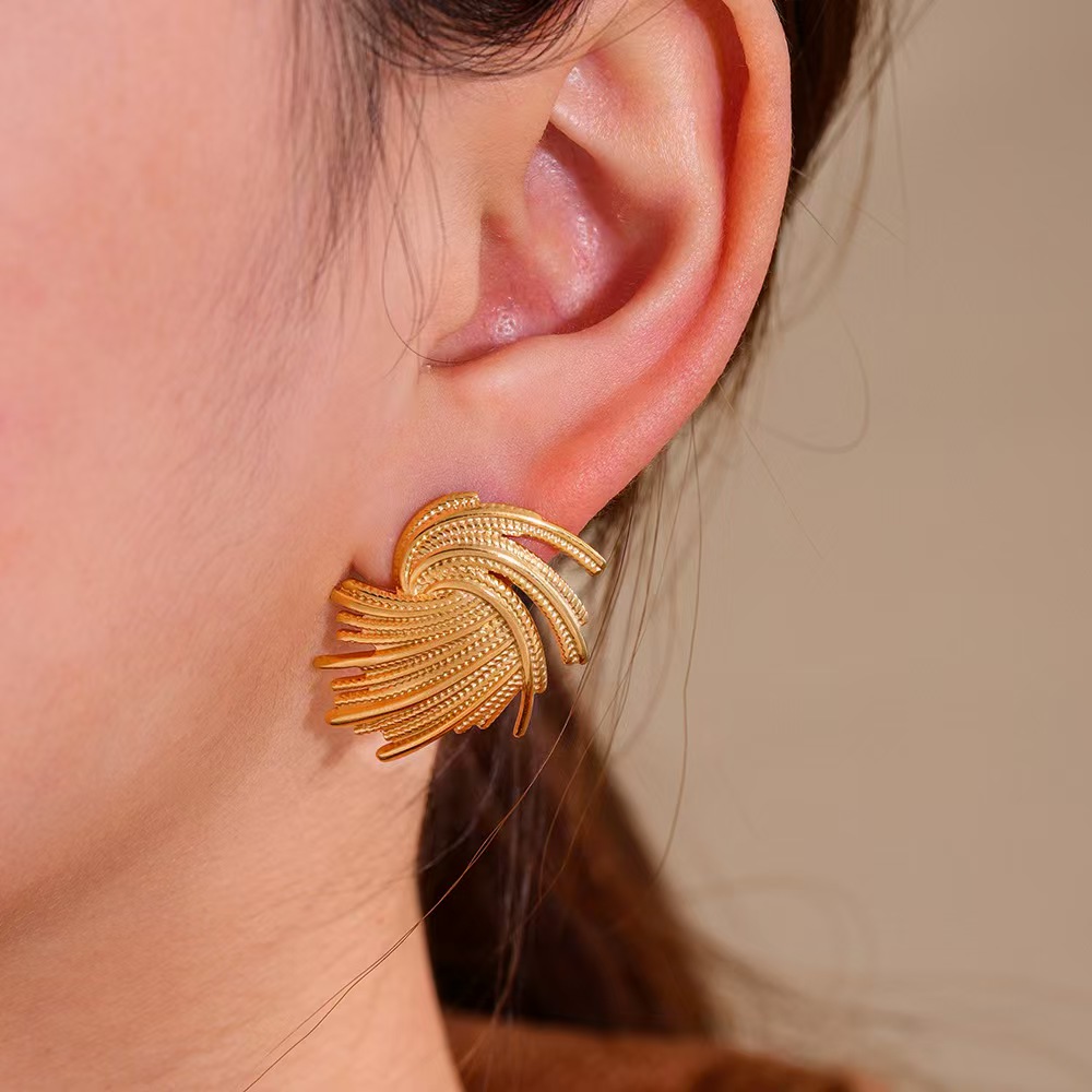 European and American retro style woven irregular vortex stainless steel earrings