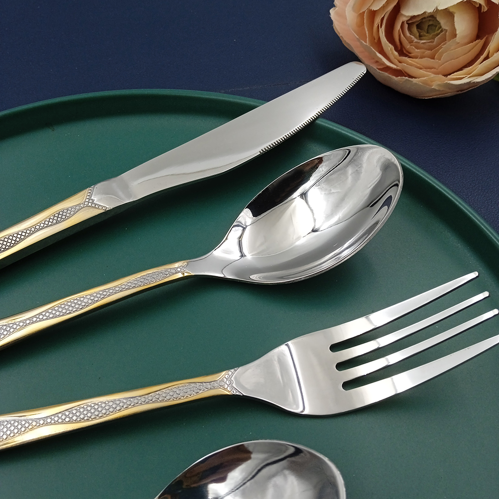 Stainless steel flatware set with gold plating