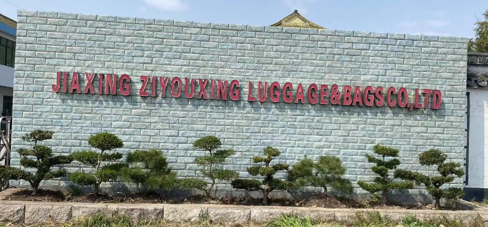 JIAXING ZIYOUXING LUGGAGE BAGS CO.,LTD logo